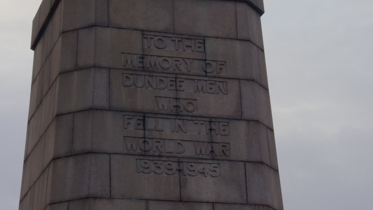 Slow zoom into the inscription on the War Memorial on law hill Dundee