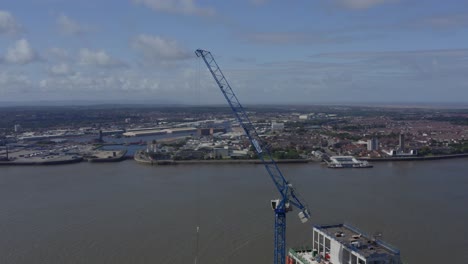 drone shot orbiting crane on sea front 01