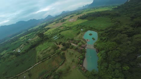 Aerial View of a Serene Tropical Landscape with a Lake and Mountains