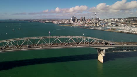 Auckland-Harbour-Bridge-aerial-reveal-of-cityscape-with-skyscapers-and-yacht-club