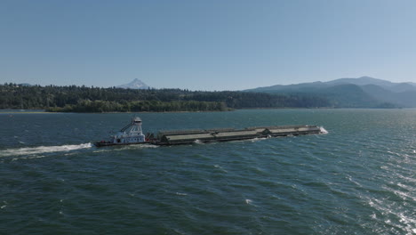 drone aerial of a barge traveling down the columbia river gorge-5