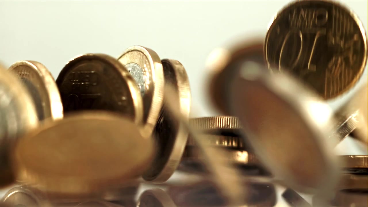 Euro Coins Falling and Scattering in Slow Motion
