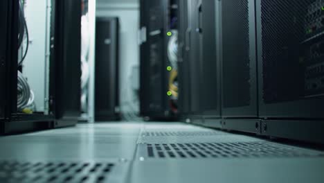 discover the inner workings of a data center where racks of servers are neatly organized. cables are routed effectively, highlighting the technology behind data storage and processing.
