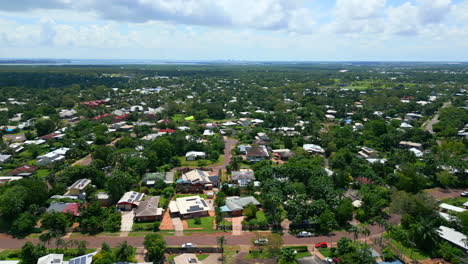 aerial drone of residential suburb in gray darwin nt australia, panoramic orbit of homes with thick tree stand