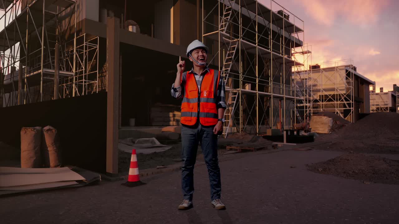 Construction Worker Gets an Idea and Smiles at Sunset