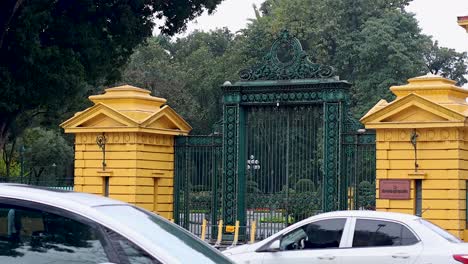 vehicles passing by the palace gate in hanoi