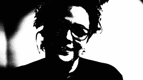 woman wearing glasses in black and white having a conversation