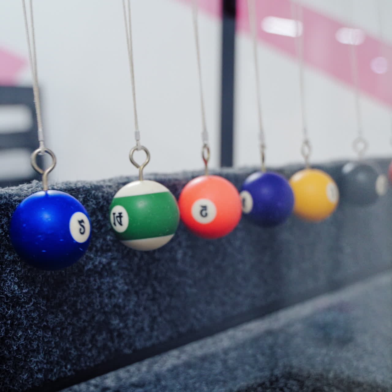 Newton's cradle showing laws of physics in motion. Museum of Science