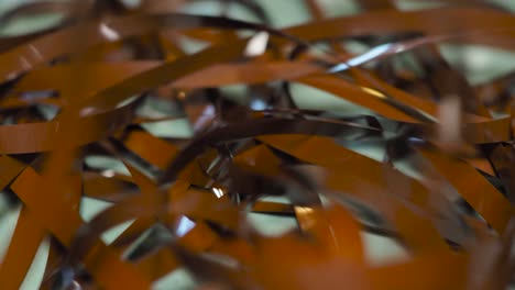 tape unreel. pulling the tape out. destroying cassette tape media. scene b