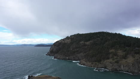 pacific northwest scene of jagged mountain cliffs by the pacific ocean