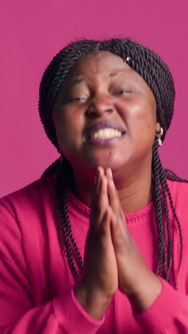 Portrait of a smiling African woman with braids