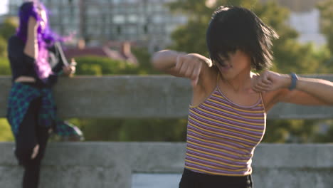 young women dancing outdoors