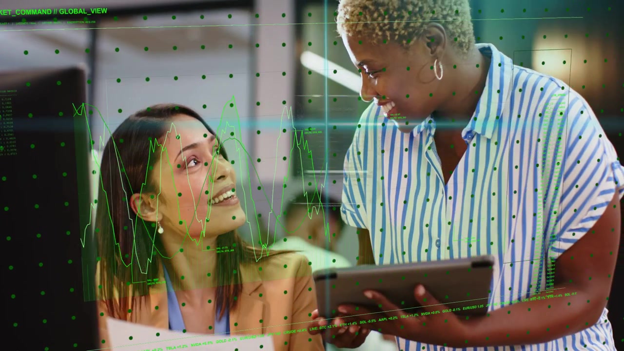 Standing peer pointing at screen guiding coworker causing green graphs reviewing business metrics