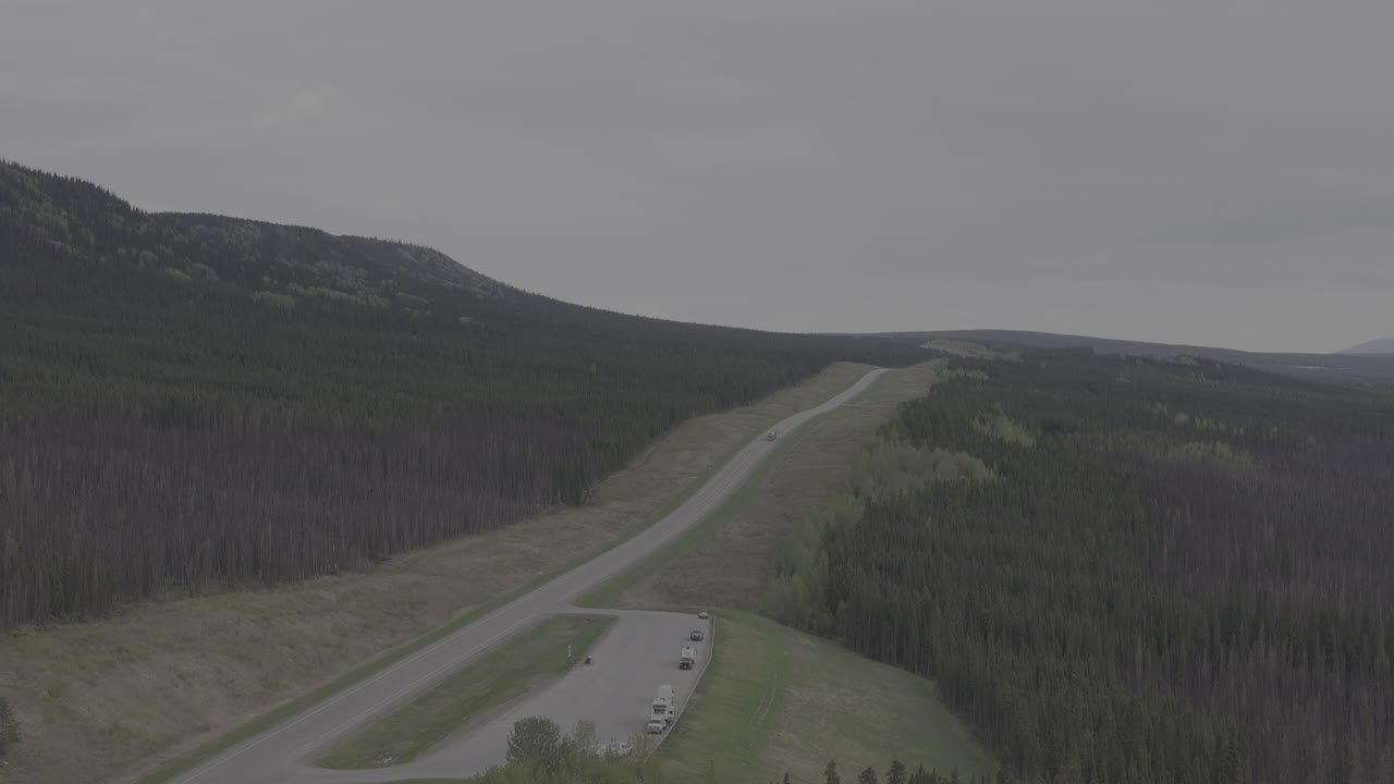 RV traveling through the vast, untouched Yukon landscape.