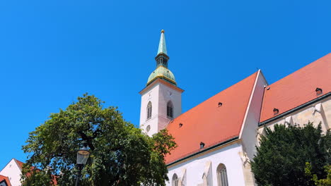 Clock tower of St. Martin's Cathedral. Low angle view. Church of Bratislava, Slovakia at the backdrop of blue clear sky