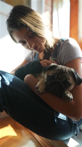 girl holding a puppy