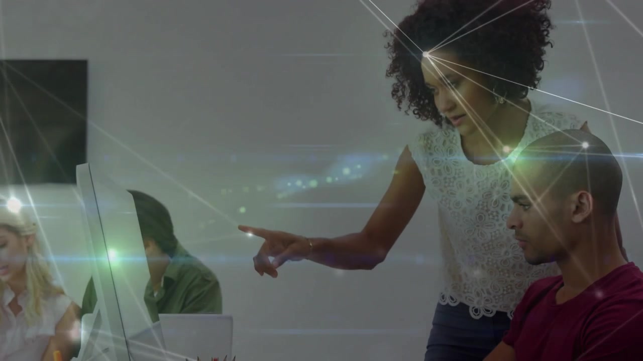 Business team lead pointing while leaning guiding peers toward network overlay for review