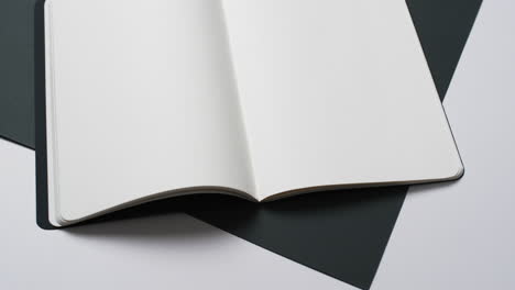 Video-of-book-with-white-blank-pages-and-copy-space-on-black-and-white-background