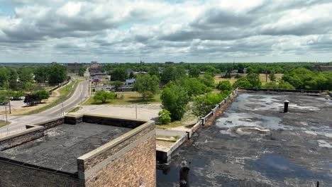 Birds-flying-over-an-old-brick-factory-building