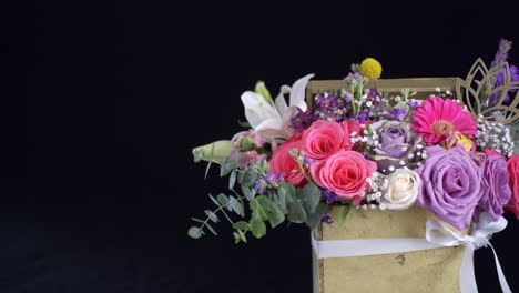 floral arrangement slider shot inside golden box lily rose daisy gerbera