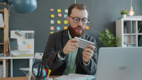 businessman working on laptop and smartphone