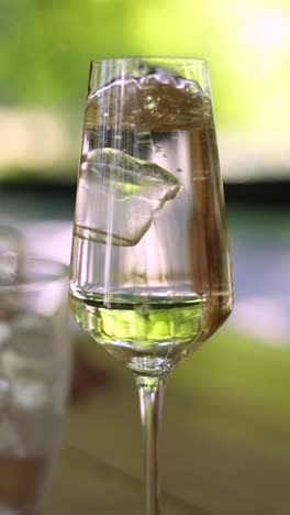 iced water in a wine glass