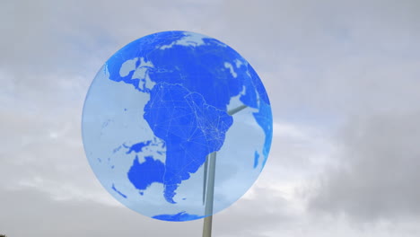 animation of globe over wind turbine against sky