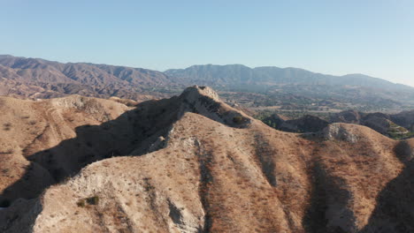 flying above mountains towards a mountain ridge in southern california