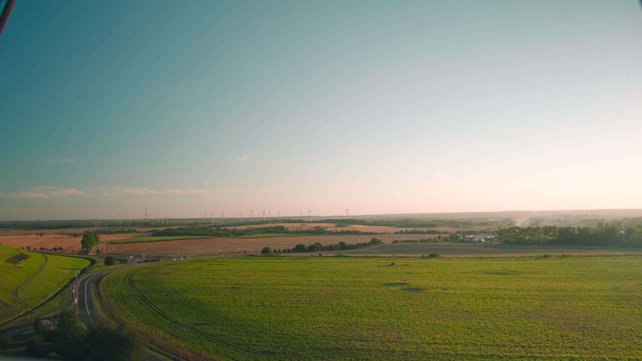 Calm overlook over rural landscape with fields and forest