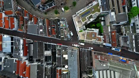 drone glides right over amsterdam rooftops and streets (60fps)
