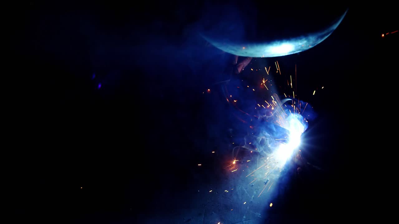 Welder working on a piece of metal