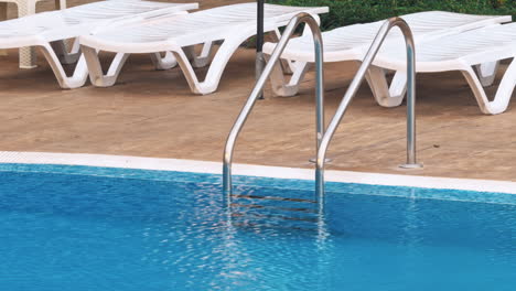 beautiful luxury umbrella and chair around outdoor swimming pool
