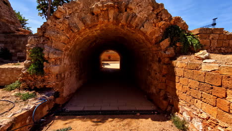 mysterious stone archway tunnel leading through ancient ruins