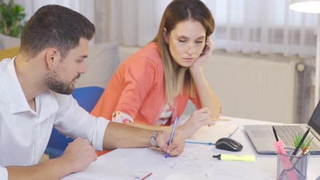 Architect-teenagers-working-in-home-office.