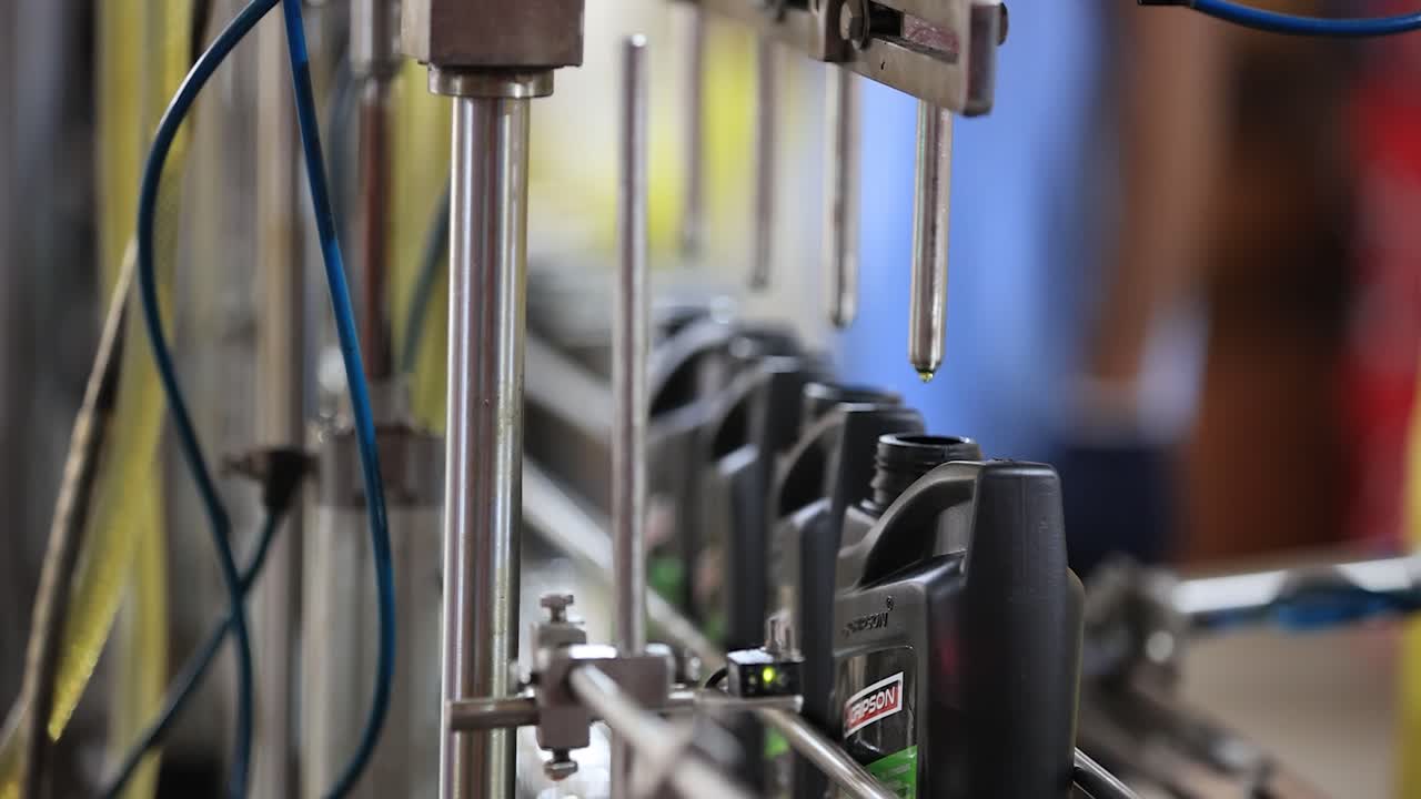 Automated Motor Oil Bottling and Packaging Line in a Factory