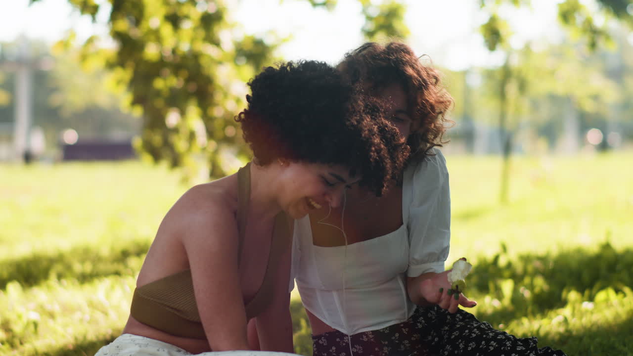 Couple listening to music in the park
