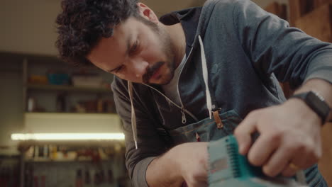 woodworker polishing board with belt sander