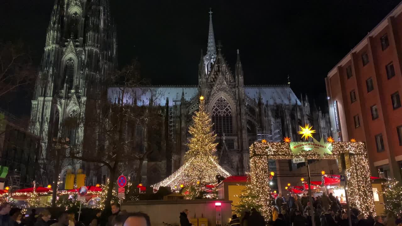 Crowds visiting the christmas market below the Dom, Cologne cathedral. Cologne has several distinct christmas markets in different locations. Editorial use only