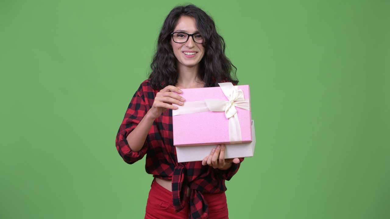 Young beautiful businesswoman with gift box