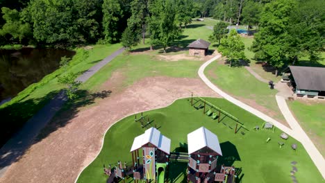 aerial footage of boyle park playground in little rock arkansas. camera flies over the playground inside the park