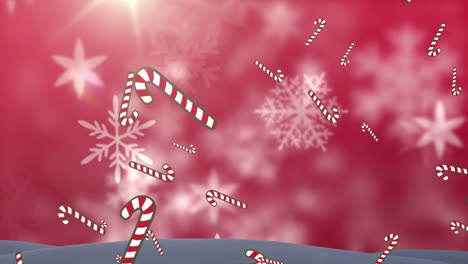 animation of candy canes and snow falling over red background