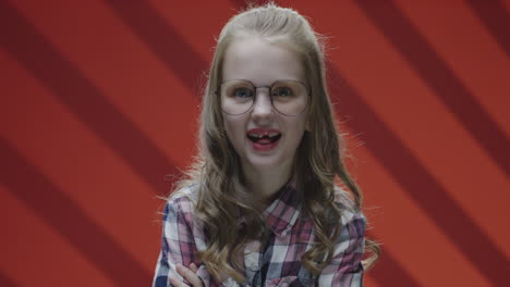 girl with glasses smiling broadly