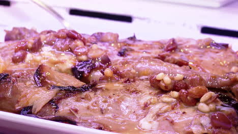 roasted pork with raisins and nuts