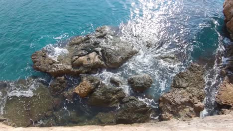 Peeking-over-the-harbor-wall-in-Antalya,-Turkey