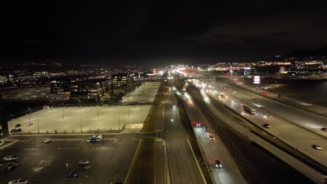 traffic along a highway at nighttime - aerial hyper lapse