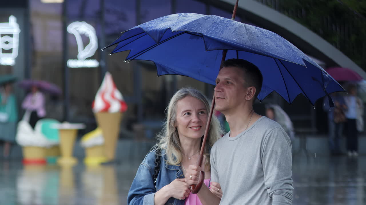 Couple under an umbrella in the rain