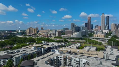 panoramic view of downtown atlanta skyline in daytime with freeways and skyscrapers in georgia, usa. - aerial shot