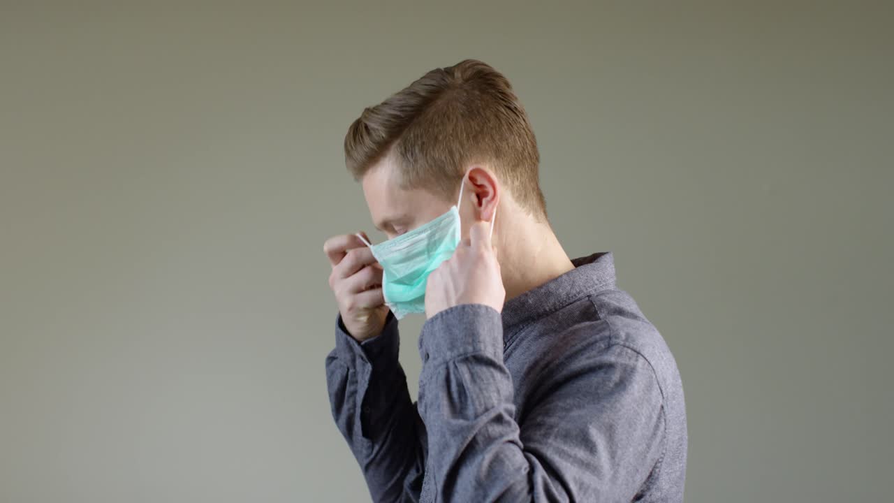 European Man Putting On Face Mask B