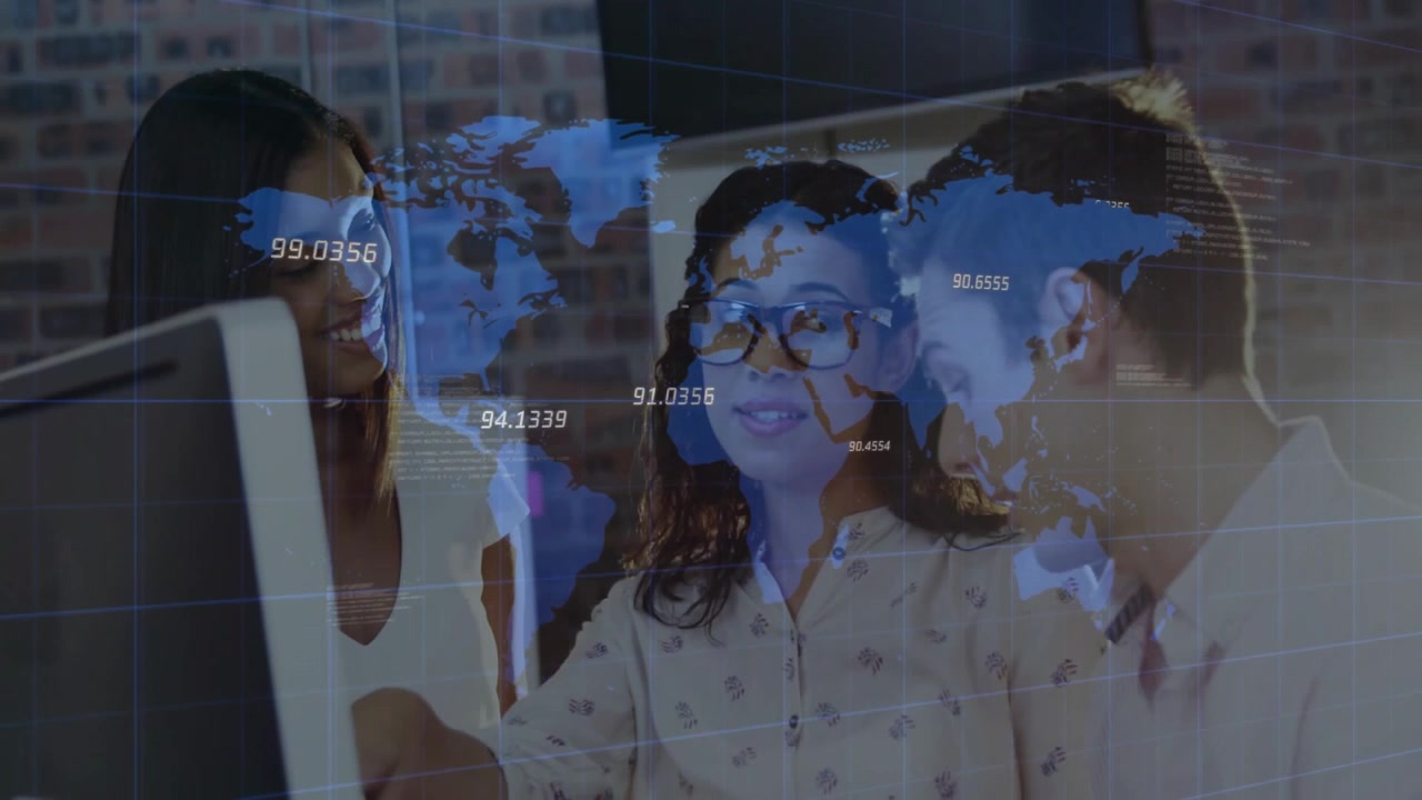 Three professionals collaborating at computer in tech office, exploring world map data overlays