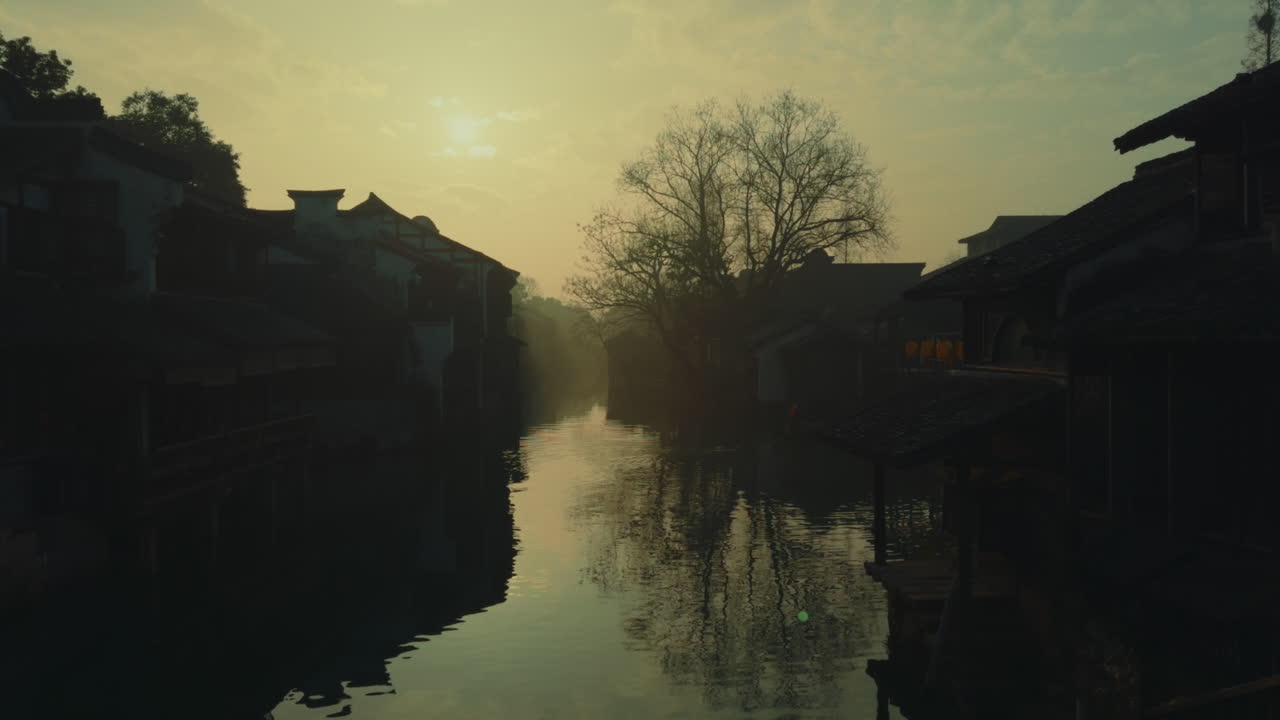 Misty Sunrise Over a Chinese Canal Town
